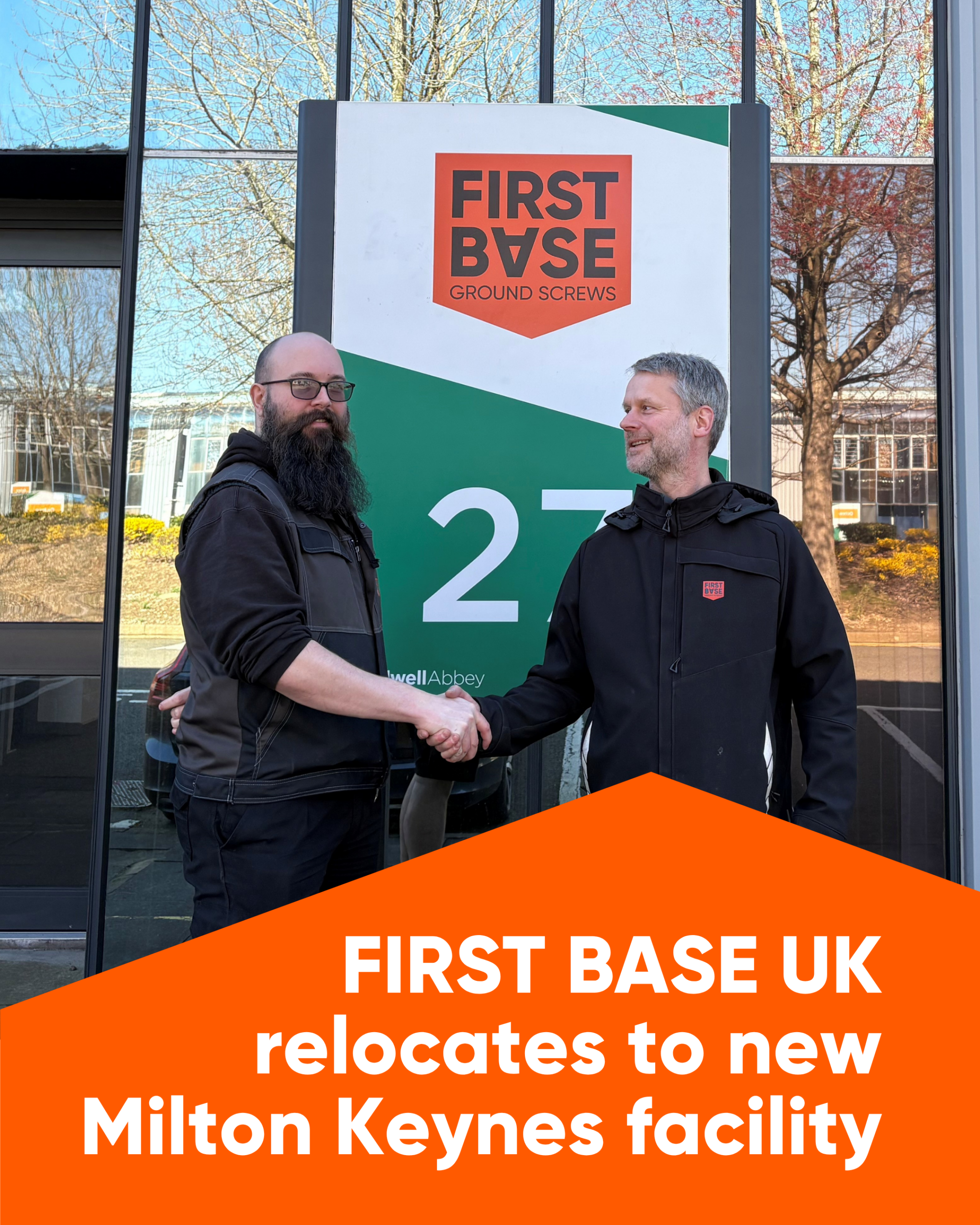 Sam Dexter and Joris Bullens shaking hands in front of the new Milton Keys office.